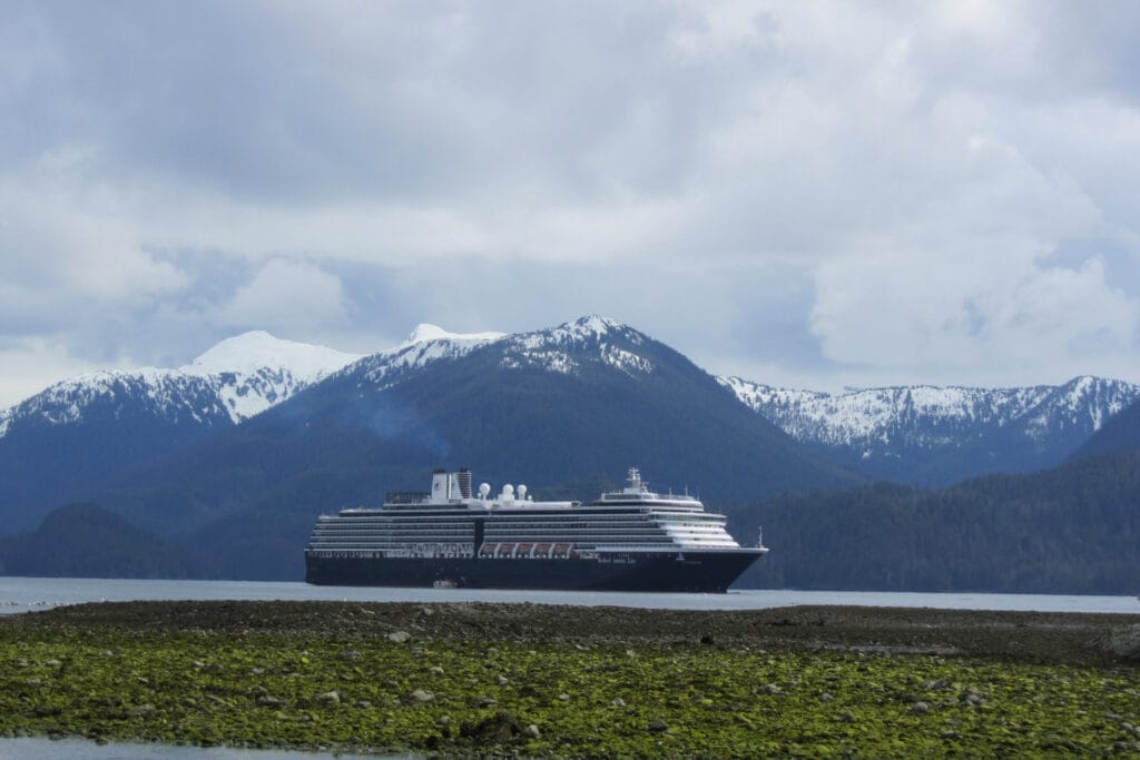 A cruise ship with mountains behind