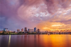 Arkansas city with bridge and sunset