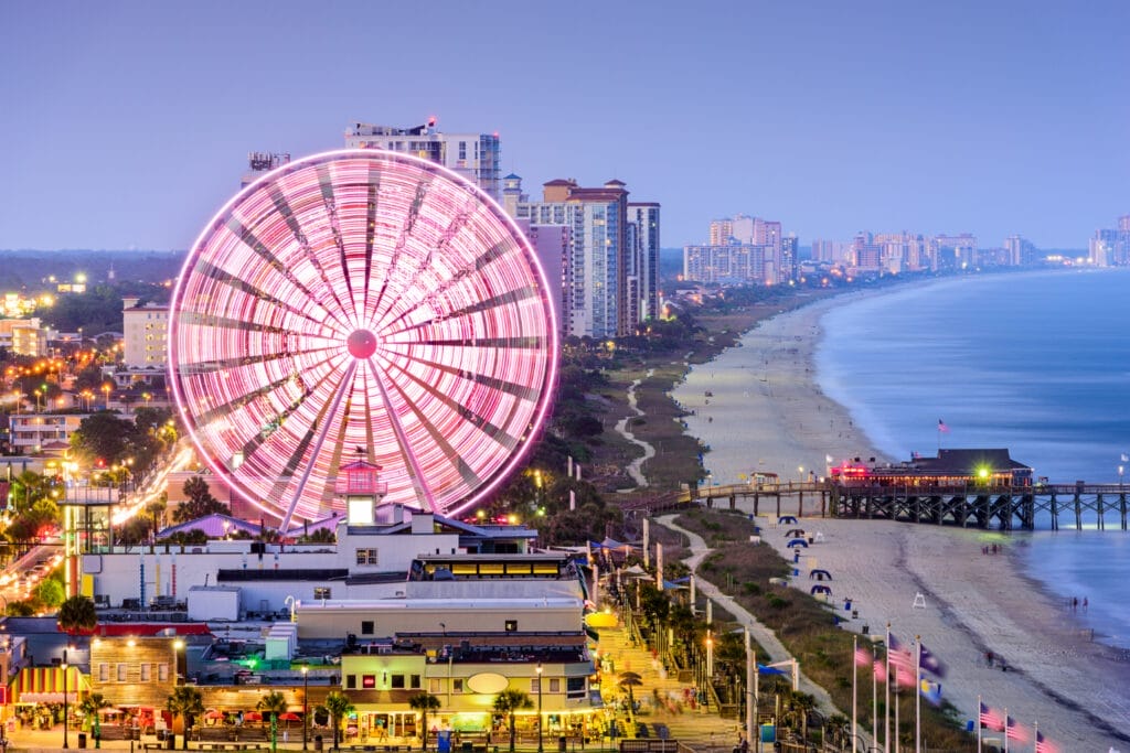 South Carolina beach with pink lit Ferris Wheel