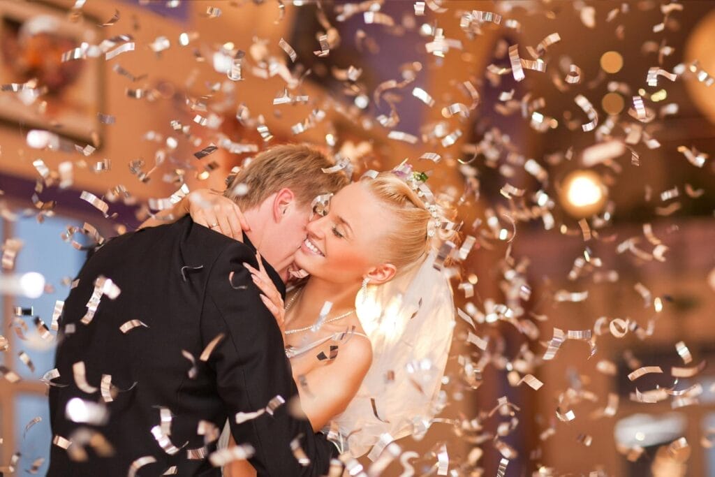 Best wedding songs (3) Couple dancing with gold confetti