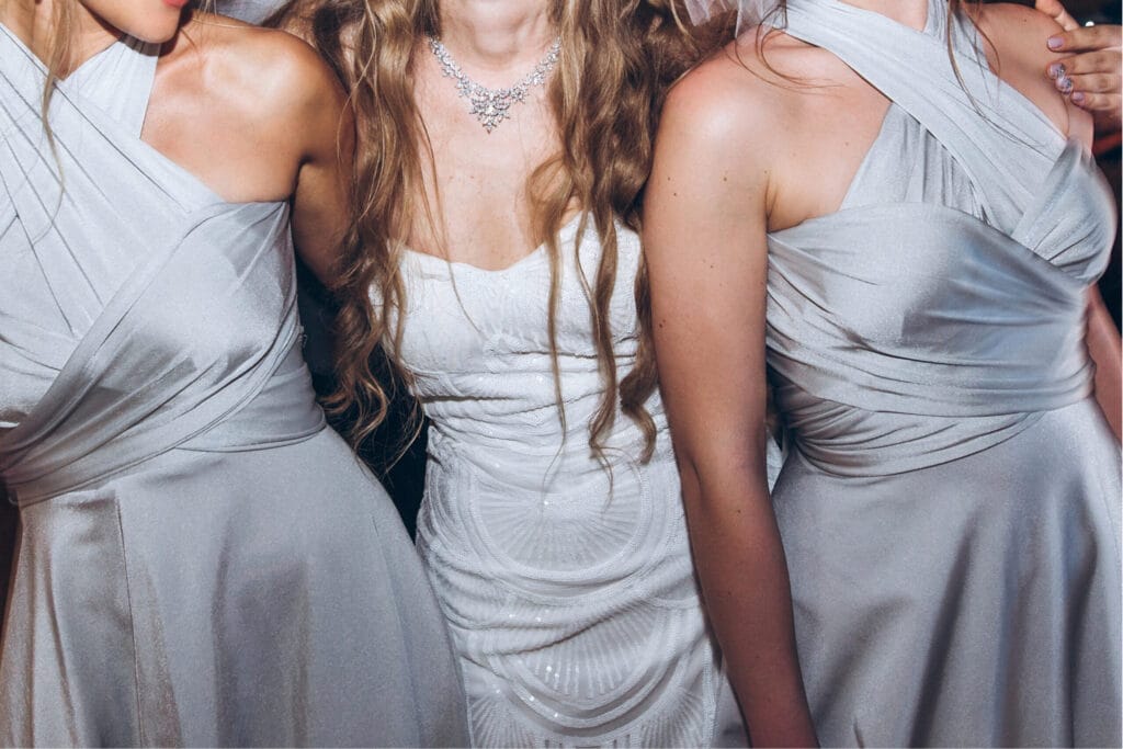 Wedding songs (1) A bride with bridesmaids up close in silver dresses